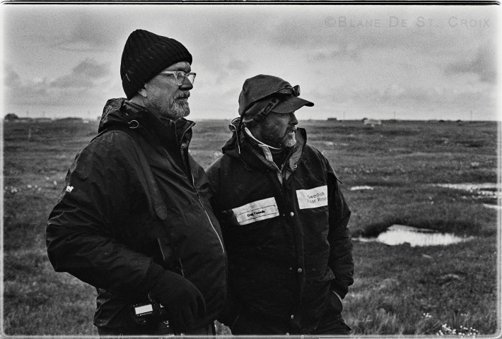 Blane De St. Croix with Climate Scientist Craig Tweedie looking across the Arctic’s Permafrost, Utqiagvik, AK, photo. Paul DeLuna