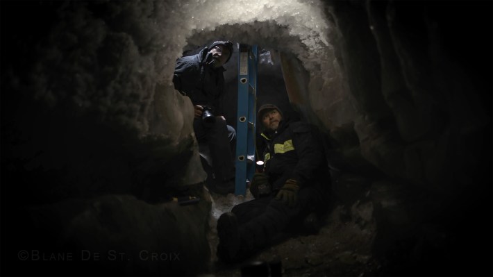 Artist with climate scientist Craig Tweedie, thirty feet below a giant ice wedge in research ice cavern dated 75,000 years, Utqiagik, AK