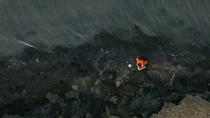 Artist plein air of permafrost eroding into the Arctic Ocean, High Arctic, Utqiagvik region, AK